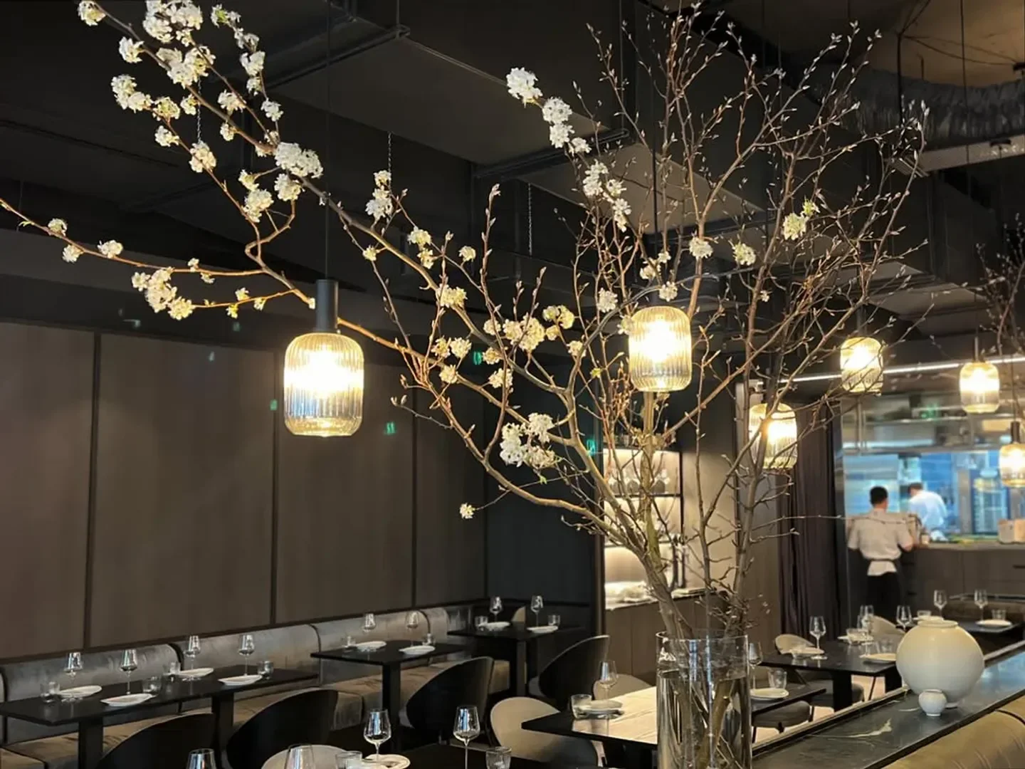 SOUL Dining in Sydney: Stylish interior with floral decor, elegant lighting and dining tables.