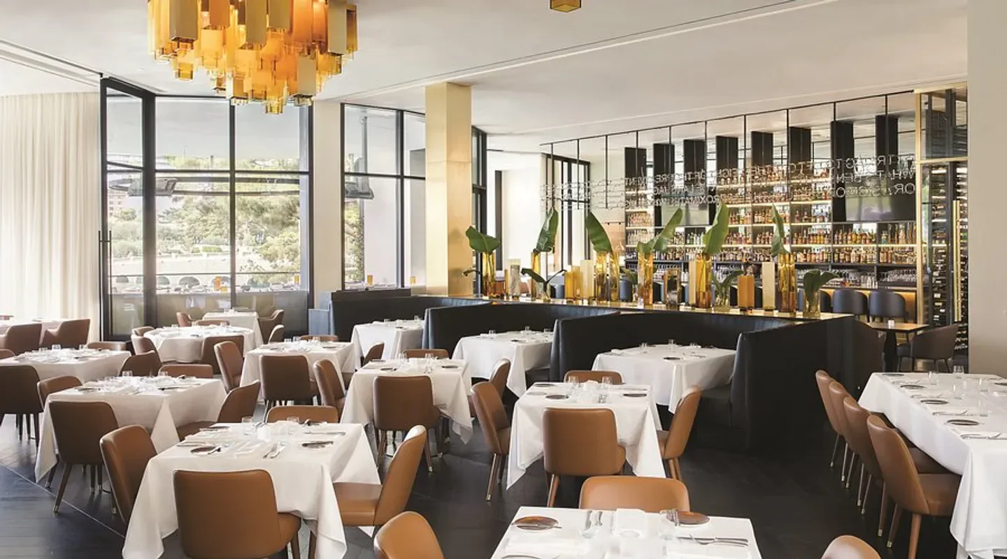 Interior dining area at Spago Las Vegas by Wolfgang Puck with elegant decor and views.