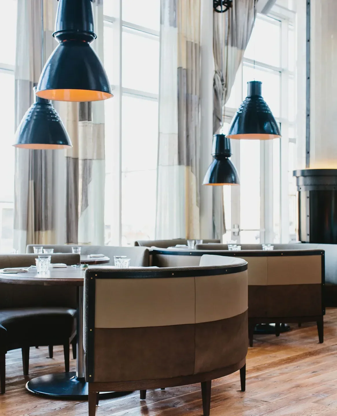 Stylish interior with hanging lights at St. Cecilia restaurant in Atlanta.