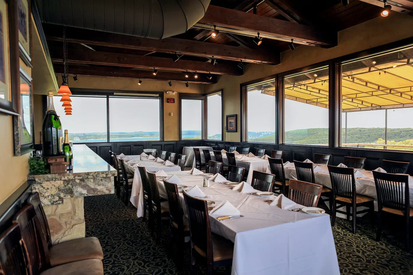 Interior dining area at Steiner Ranch Steakhouse in Austin with a scenic lake view.