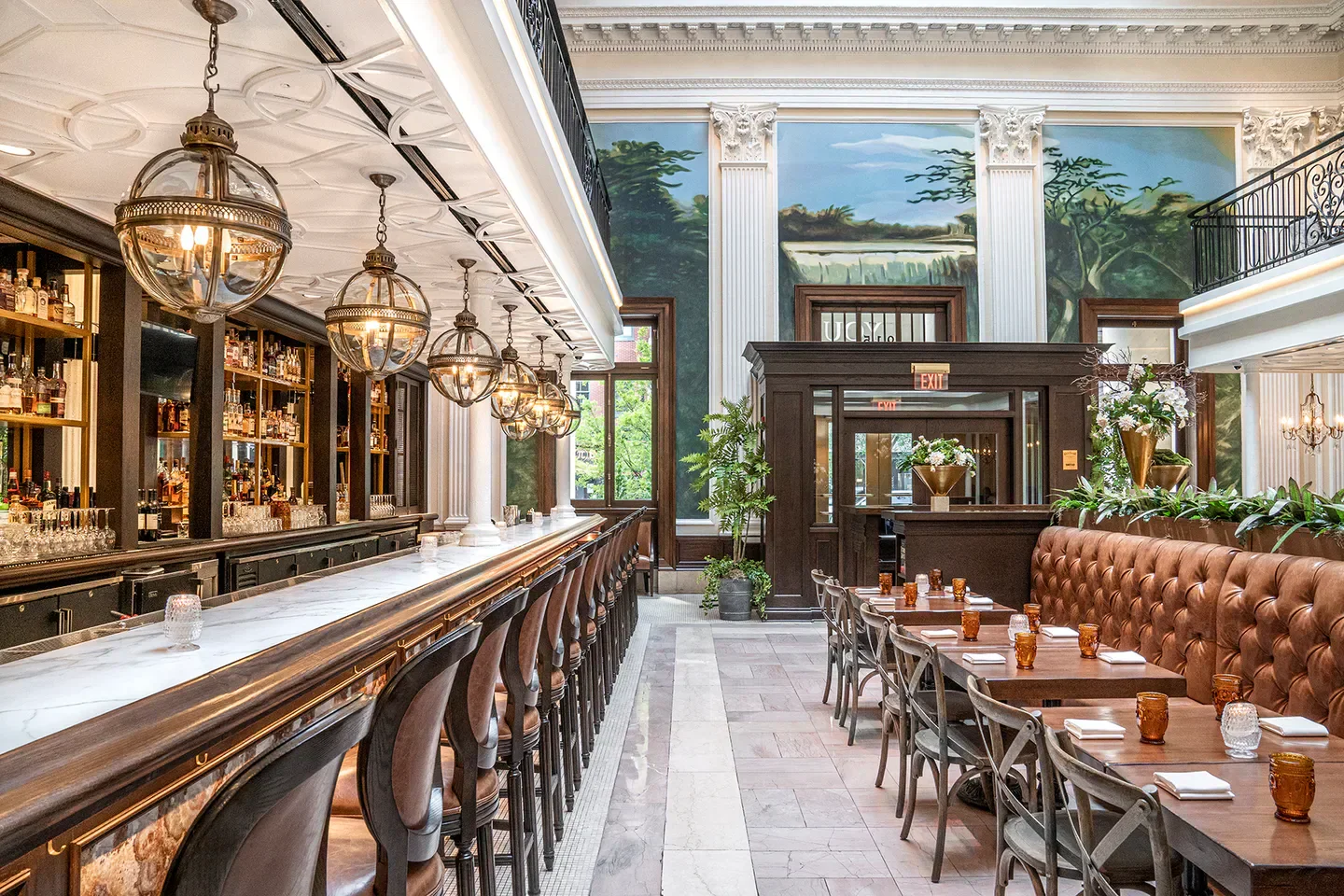 Interior view of Succotash restaurant in Washington, DC, with bar and dining area.