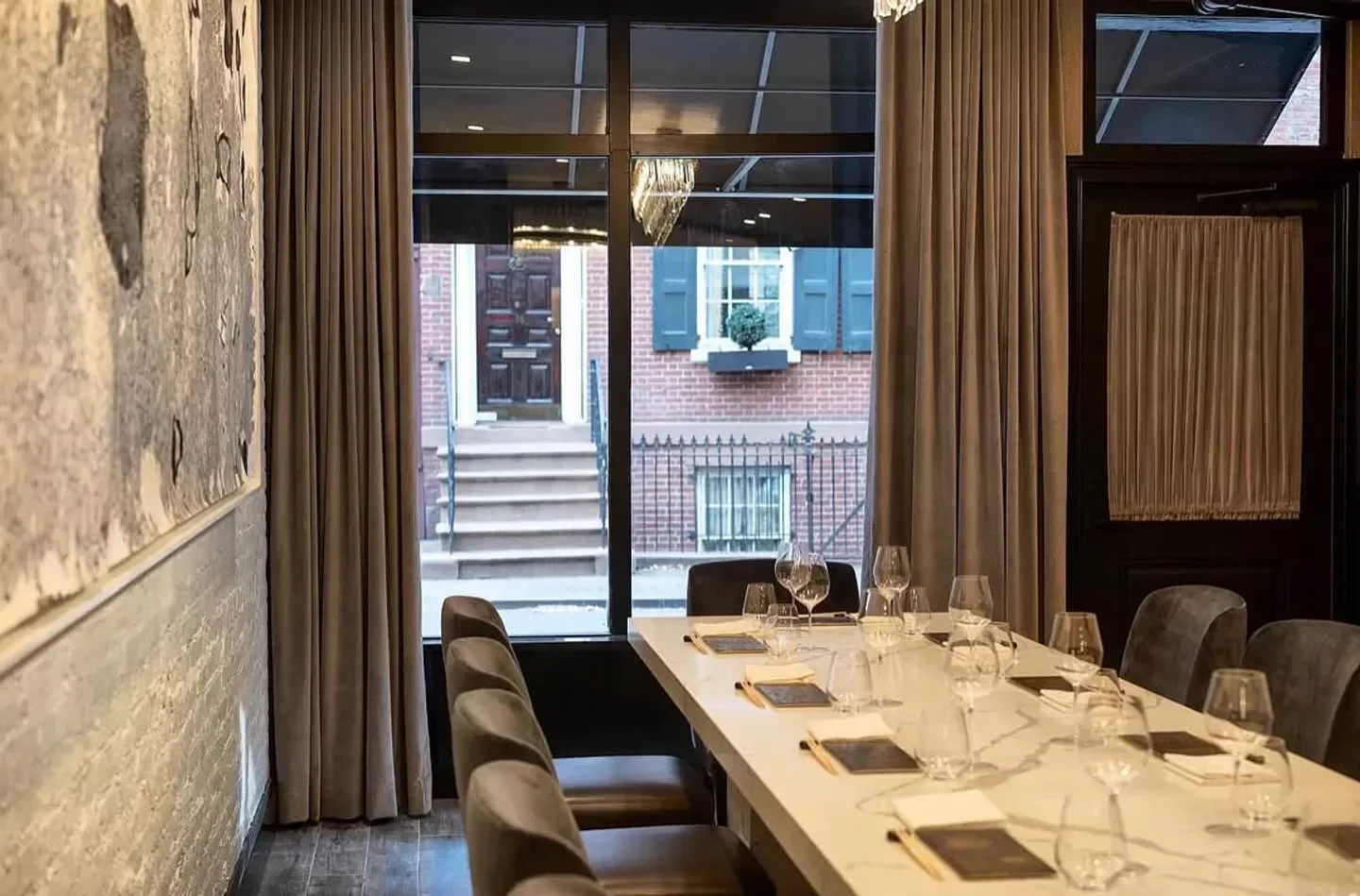 Elegant dining room interior at Sushi Nakazawa in Washington, with a view of the street.