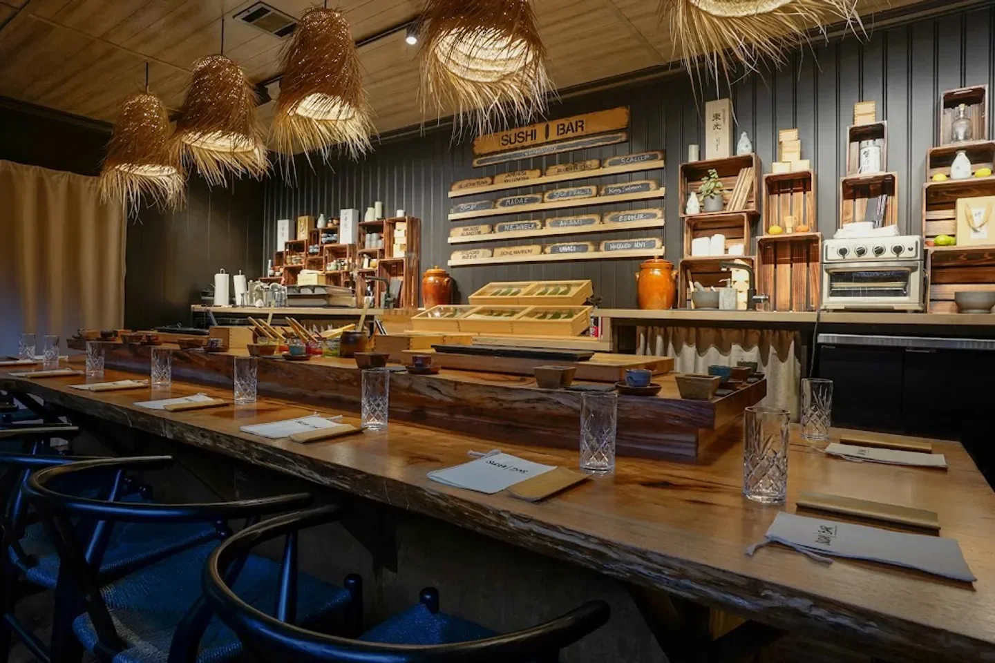 Interior of Sushi | Bar ATX in Austin, featuring sushi bar and unique lighting.