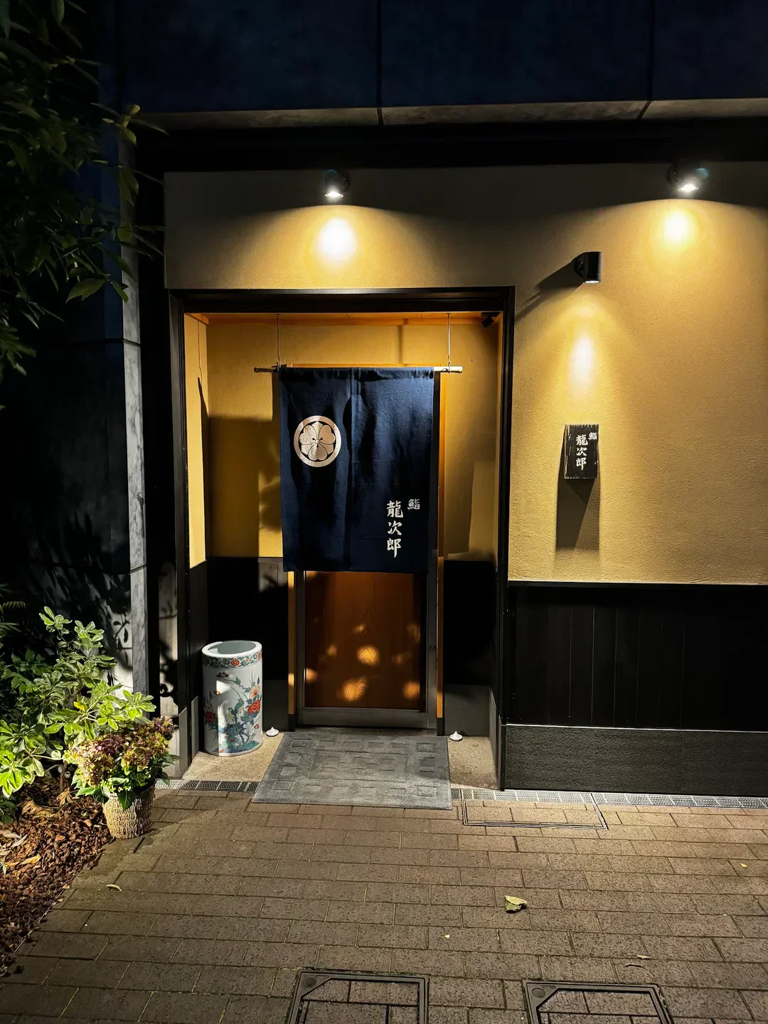 Entrance of Sushi Ryujiro in Tokyo, Japan, with its traditional Japanese decor.