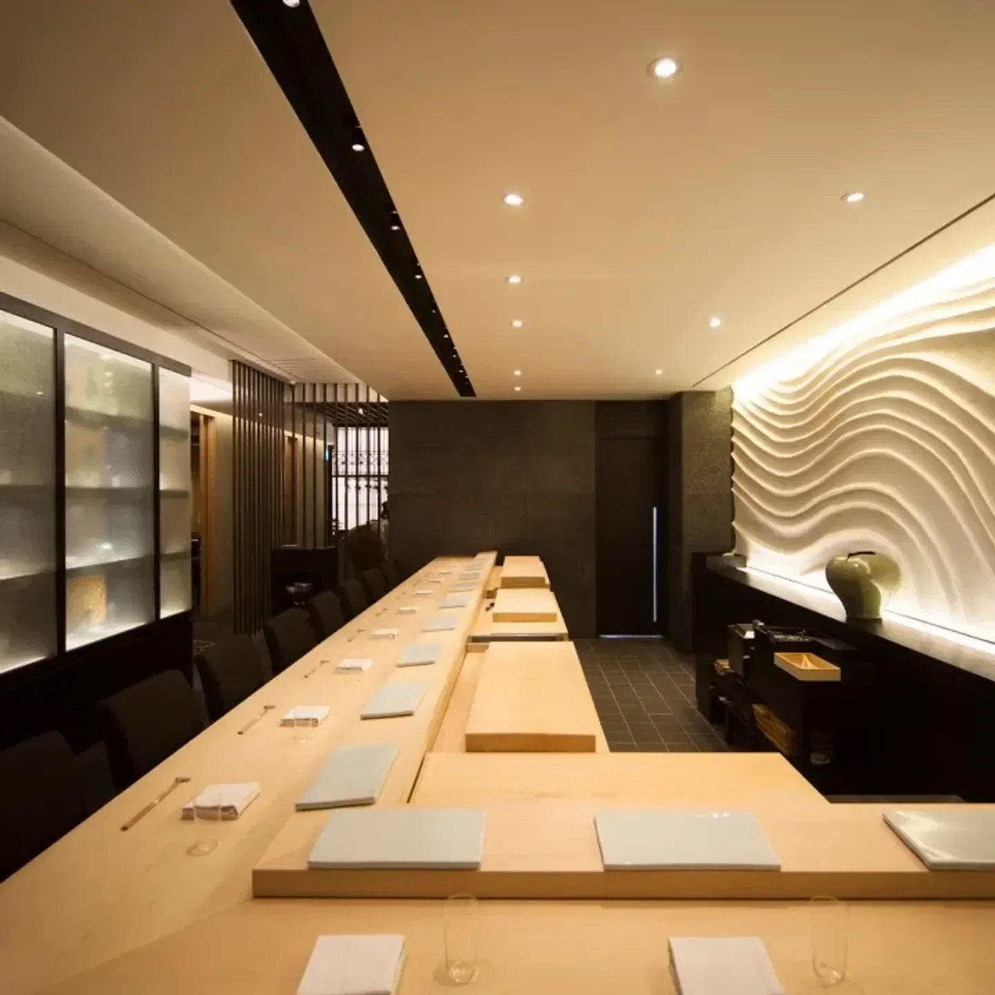 Interior of Sushi Sunsoo restaurant in Seoul, featuring a sleek, modern sushi bar design.