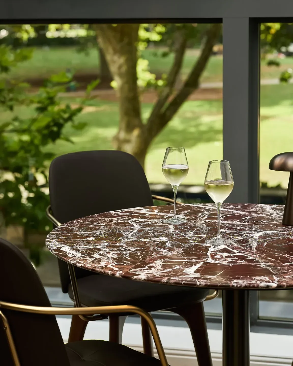 Wine glasses on a table at Sydney Common, a restaurant in Sydney.