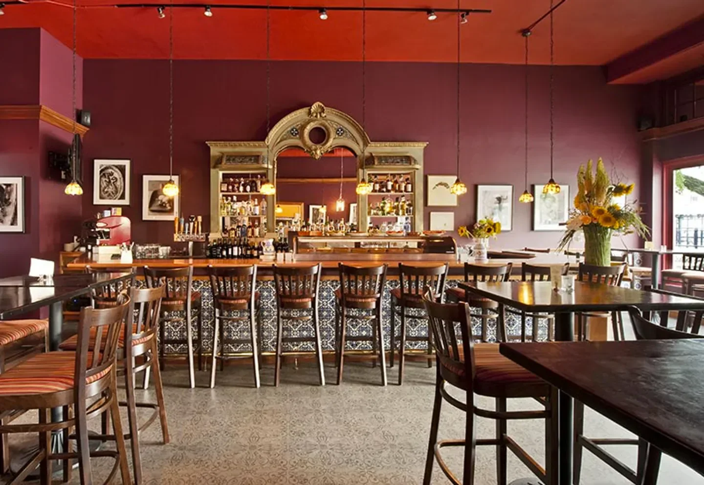 Interior of Taberna de Haro restaurant in Boston, featuring bar and seating area.