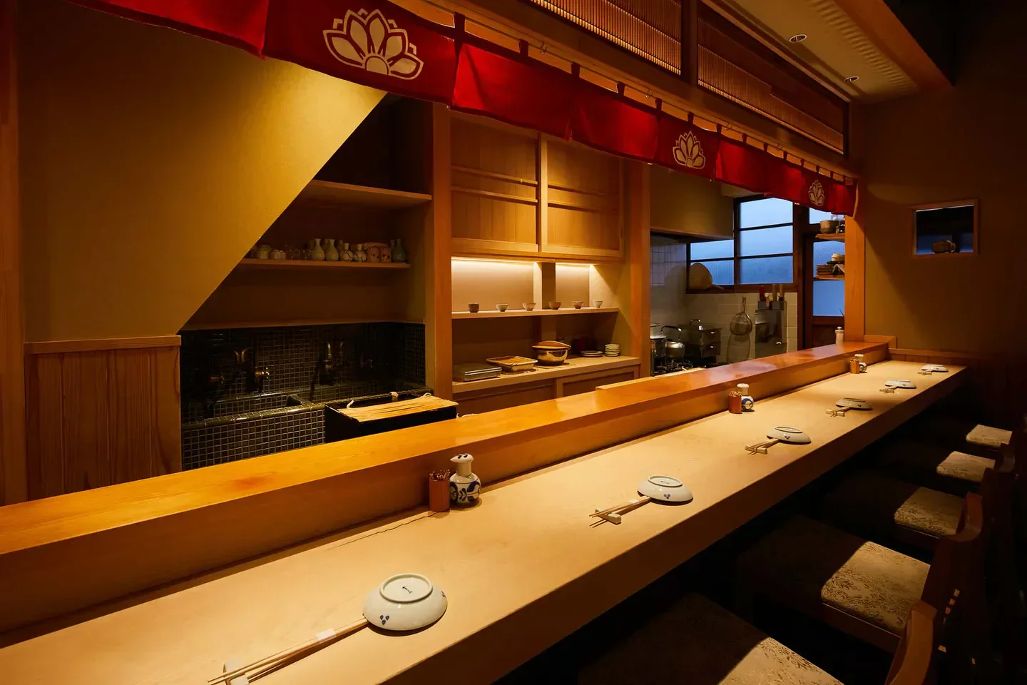 Interior view of Takagakino Sushi in Tokyo, showing sushi bar and dining area.
