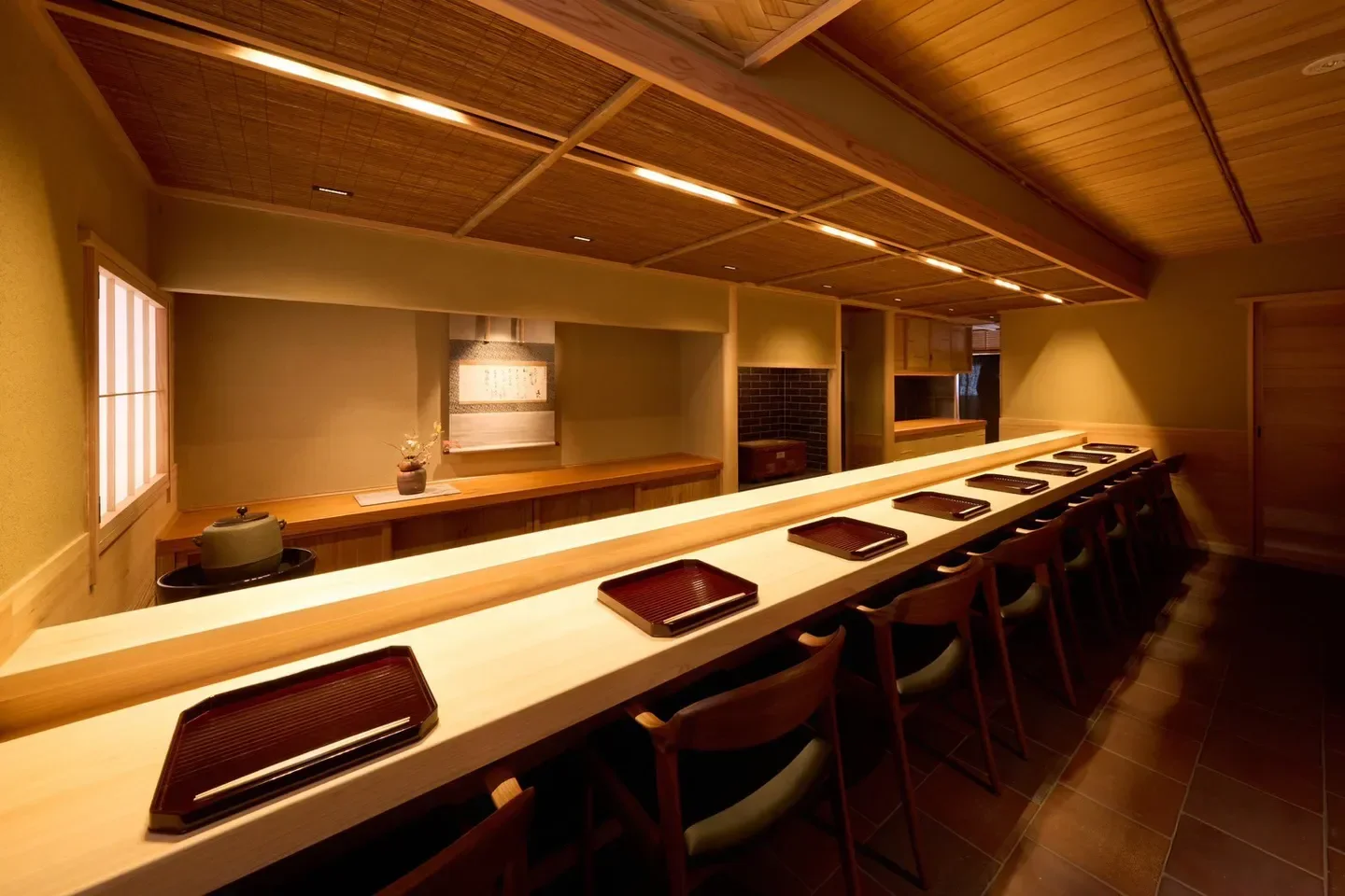 Interior view of Tanimoto restaurant in Tokyo, featuring a minimalist sushi counter.