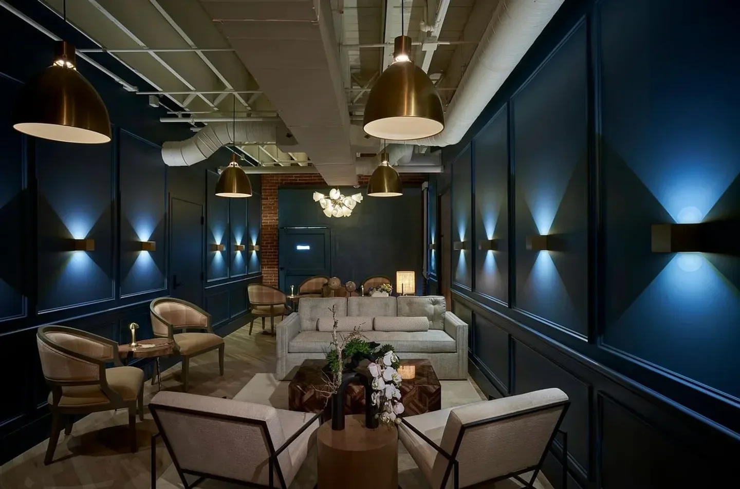 Elegant lounge area at Tatsu Dallas restaurant in Dallas, with stylish lighting and decor