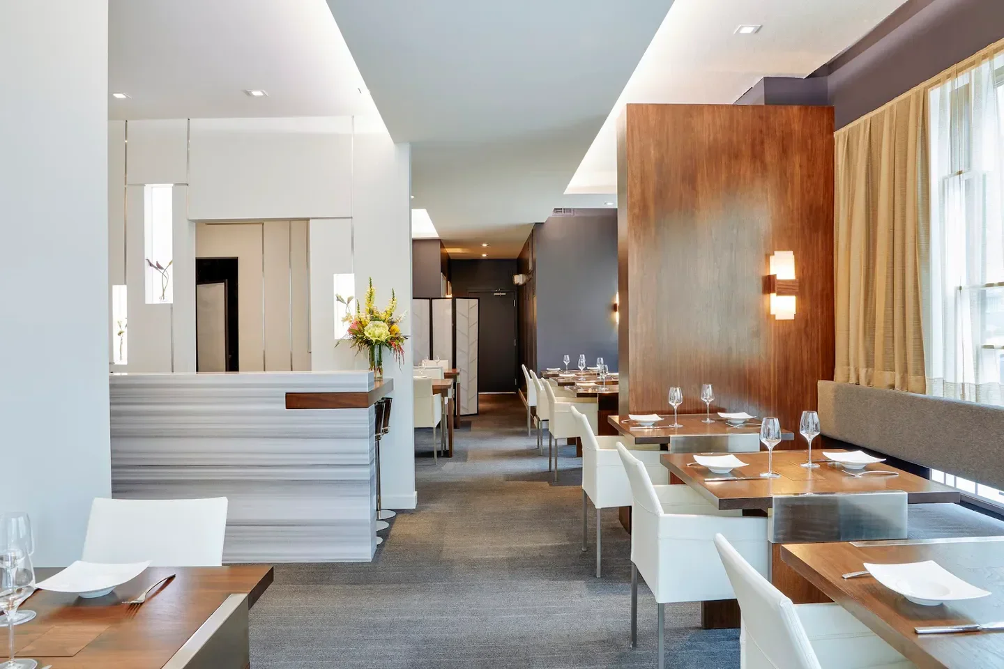 Elegant interior of Temporis restaurant in Chicago, with dining tables and decor.