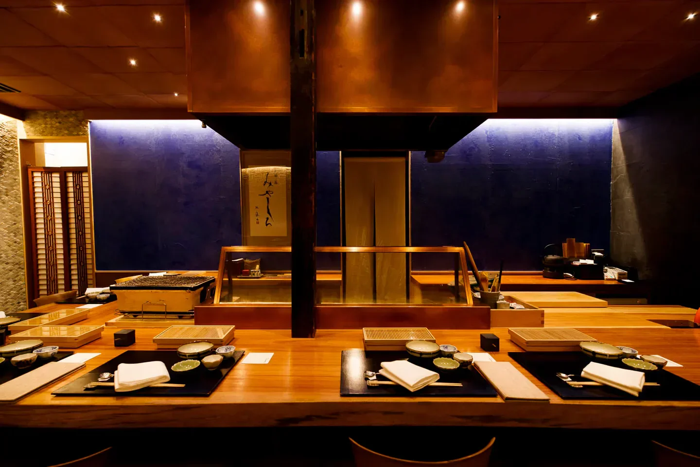 Interior of Tempura Miyashiro restaurant in Tokyo, featuring sushi counter and elegant decor.
