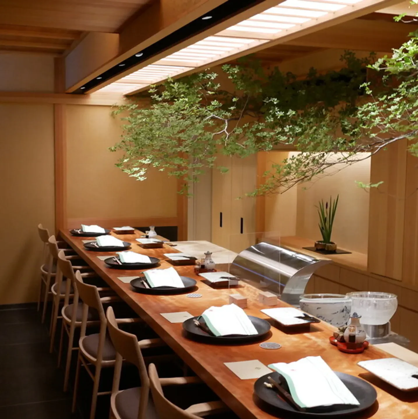 Interior of Tempura Motoyoshi restaurant in Tokyo featuring elegant dining and decor.