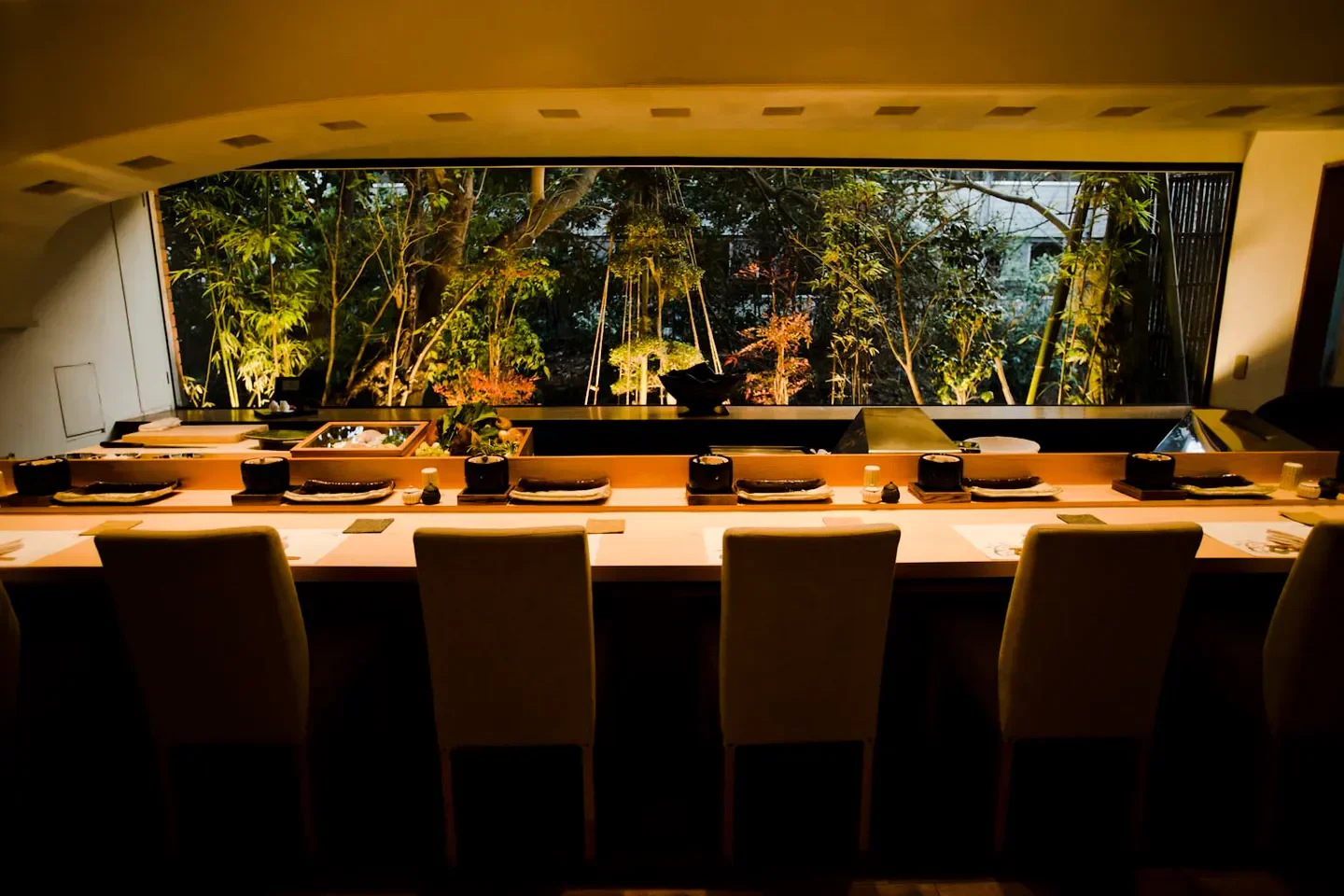 Interior view of Tentempura Uchitsu in Tokyo, with a beautiful view of nature.