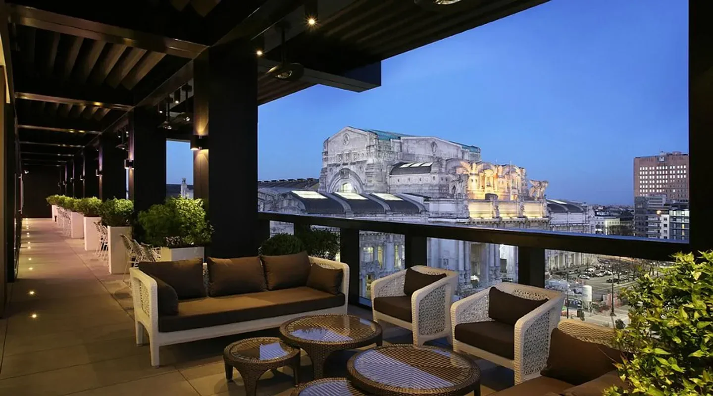 Terrazza Gallia restaurant in Milan with outdoor seating and city views at dusk