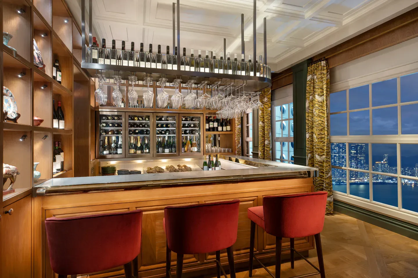 Stylish bar at The Aubrey restaurant in Hong Kong, with stunning city views.