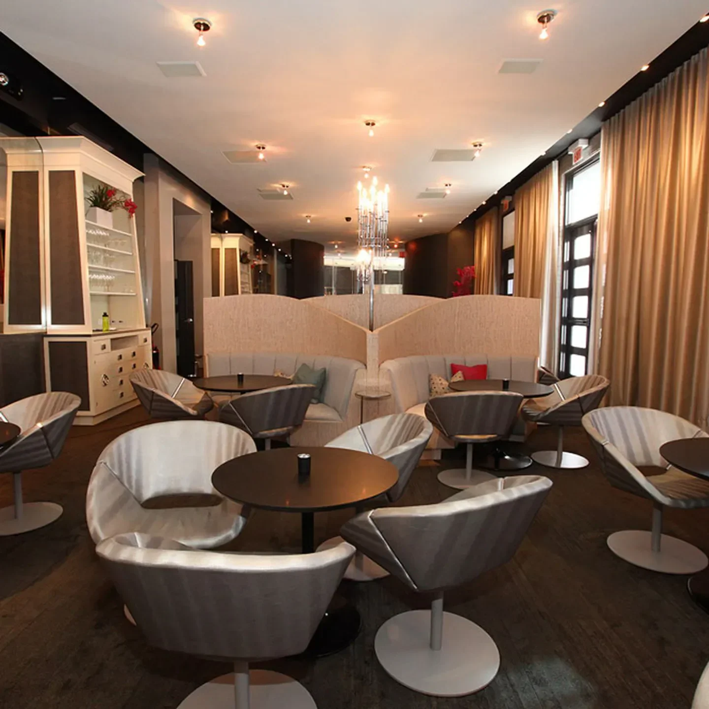 Interior of The Aviary in Chicago, featuring modern seating and elegant ambiance.