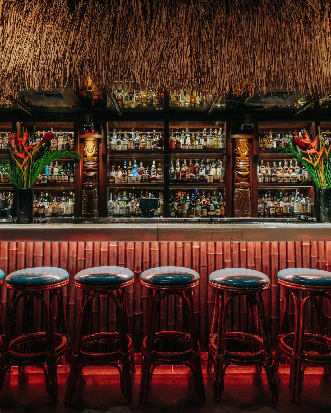Interior of The Bamboo Room at Three Dots and a Dash in Chicago, showcasing tiki bar.