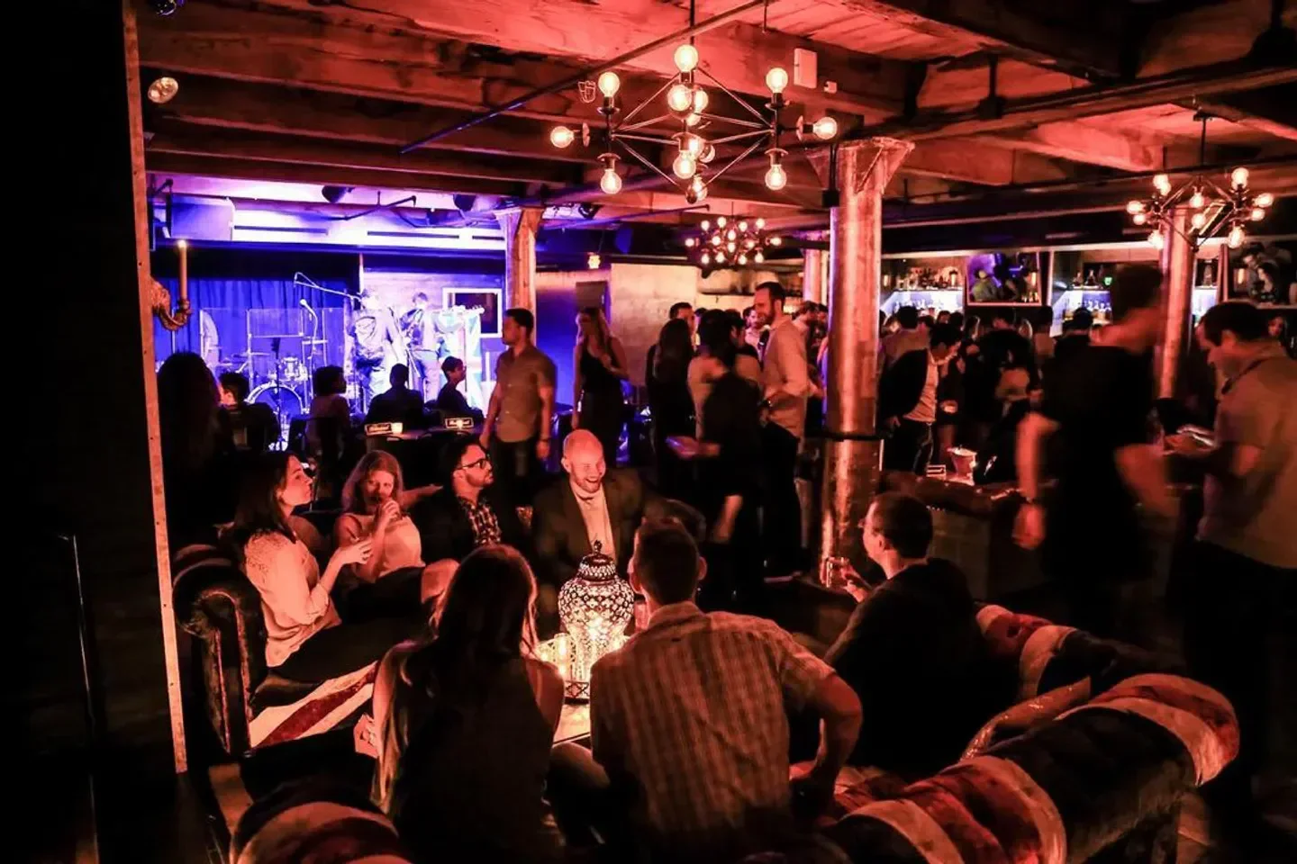 Interior view of The Bassment in Chicago with a live band and crowded lounge area.