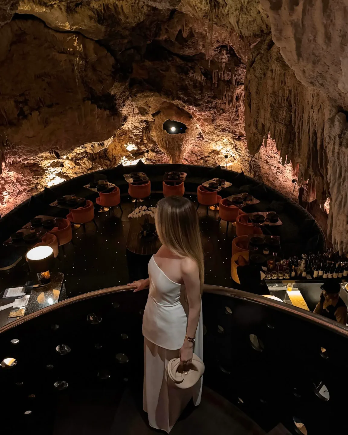 The Cave by Chef Ryan Clift restaurant interior featuring dramatic cave rock formations and intimate seating in the city.