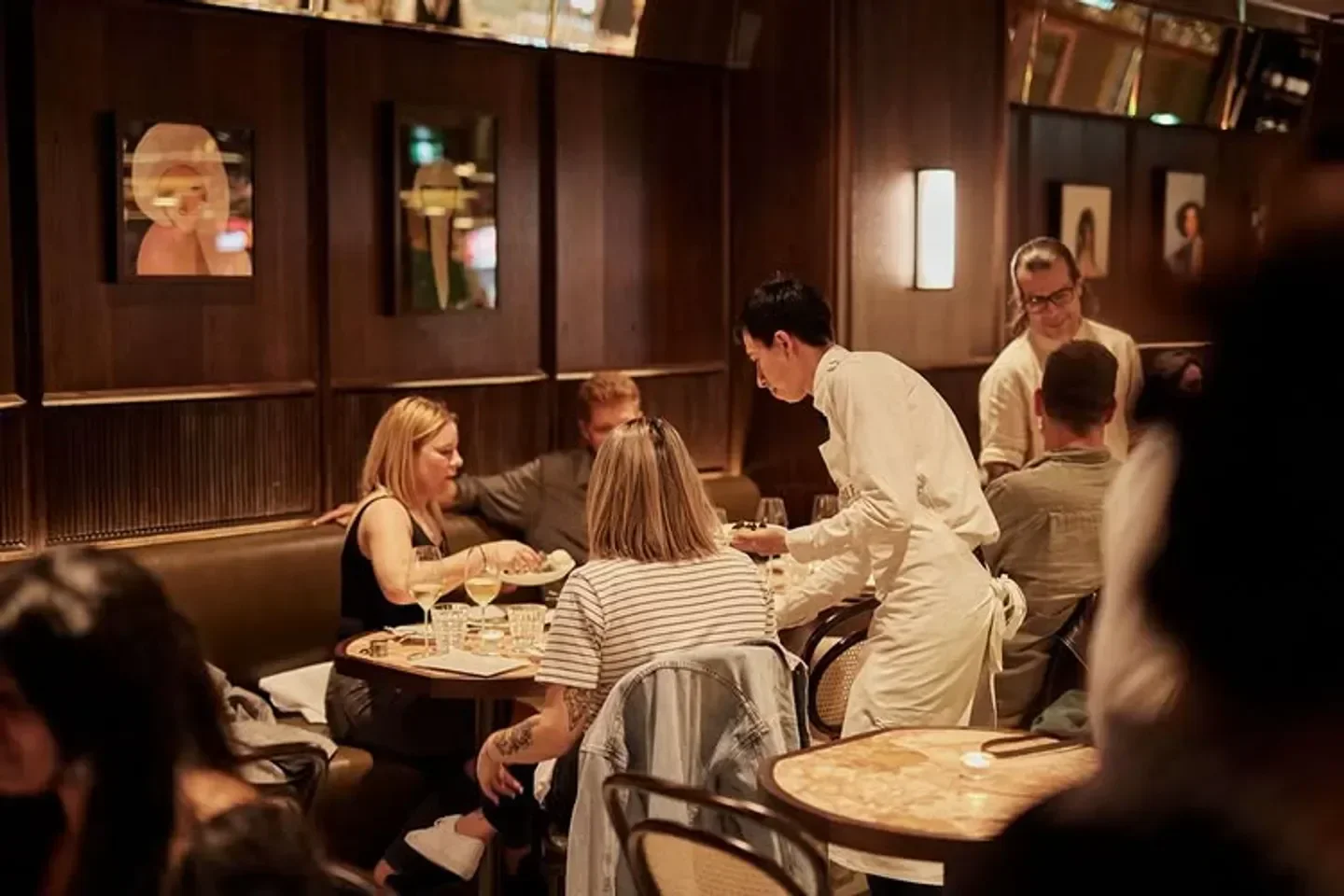 Dining at The Charles Grand Brasserie in Sydney with waitstaff and patrons enjoying.