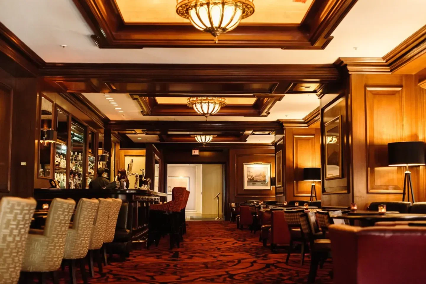 Interior of The Dark Bar in Boston, featuring warm lighting and classic decor.