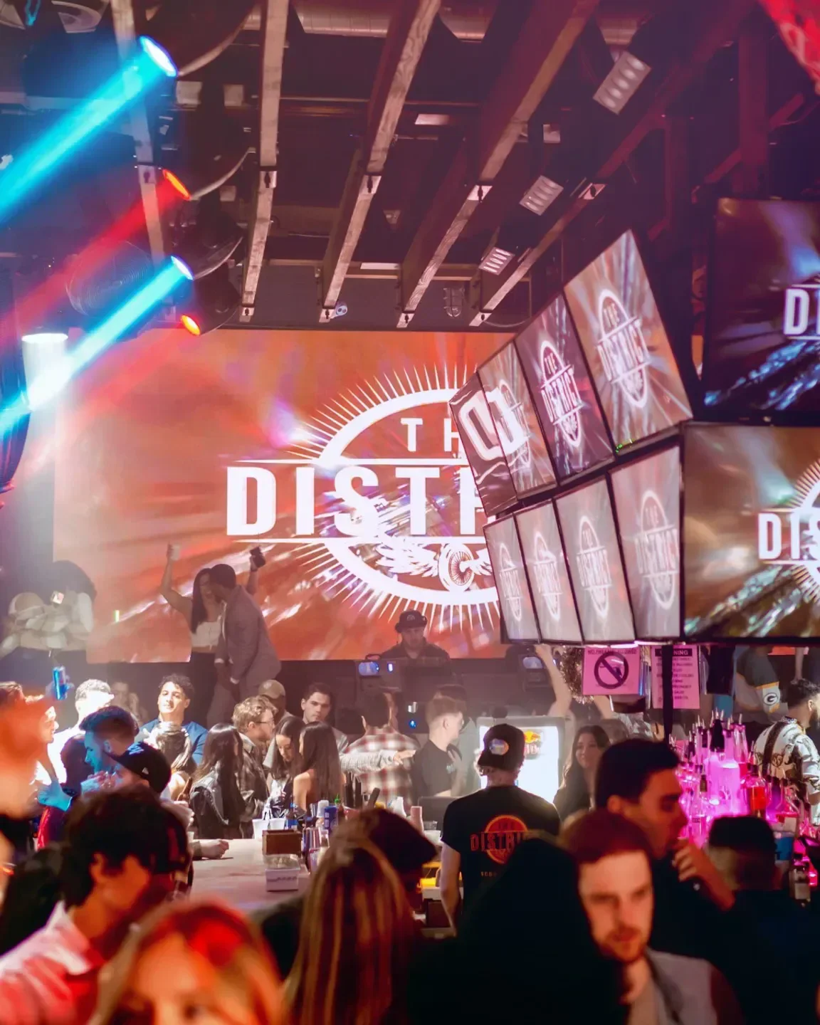 Inside The District nightclub in Scottsdale, with lights and people enjoying the atmosphere.