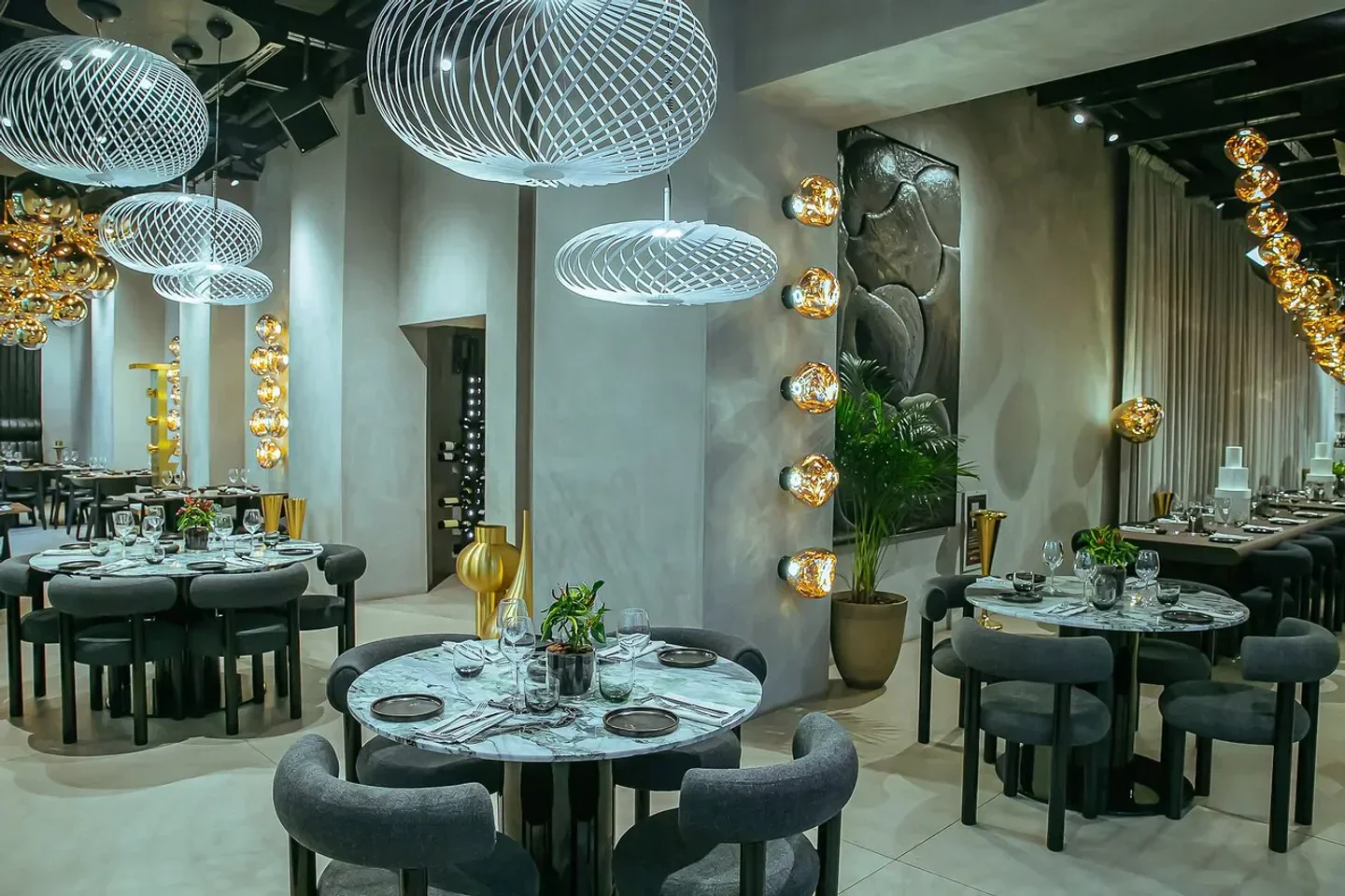 Elegant dining room interior at The Manzoni restaurant in Milan, with stylish lighting.