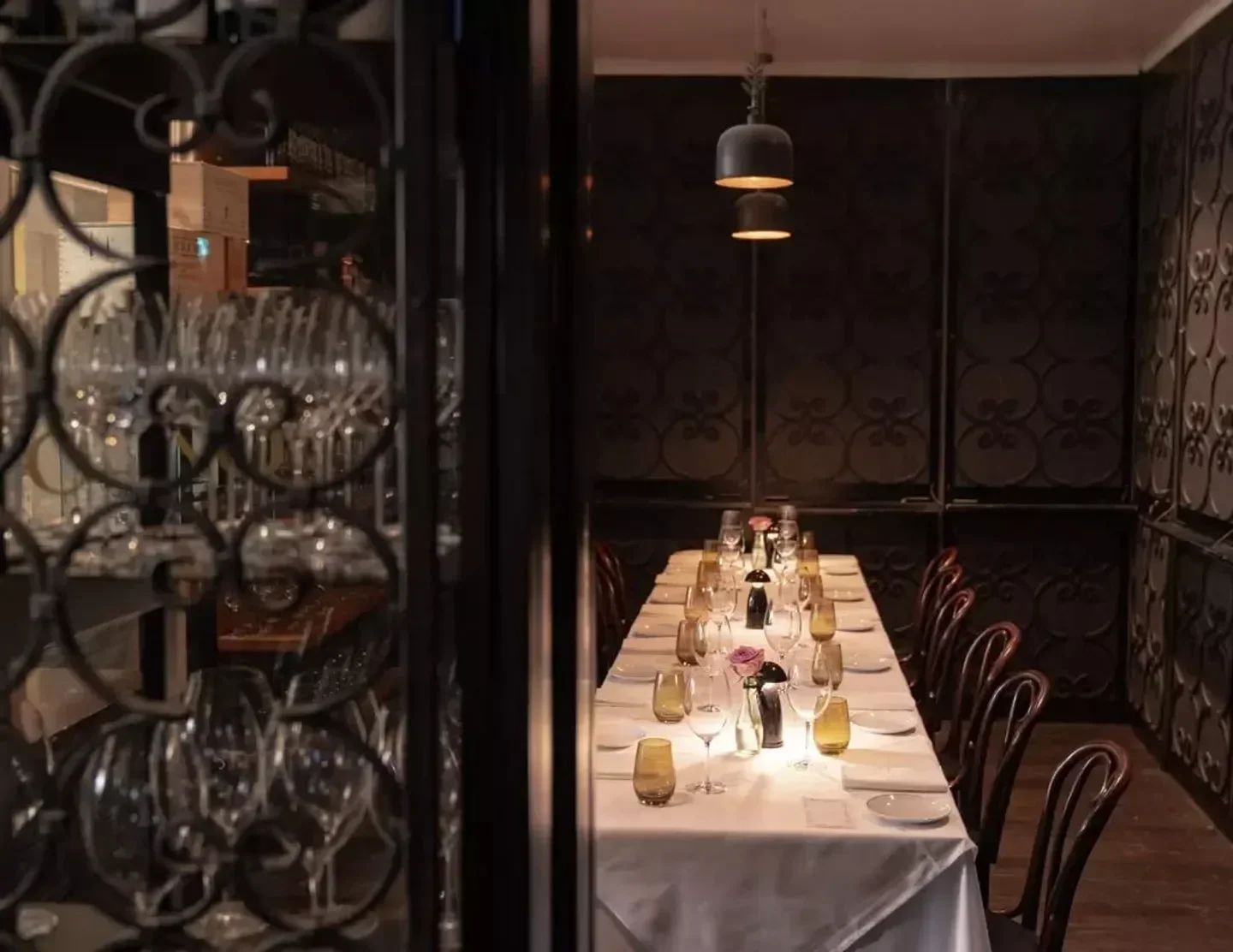 Elegant dining at The Restaurant Pendolino in Sydney, featuring a long table setting.