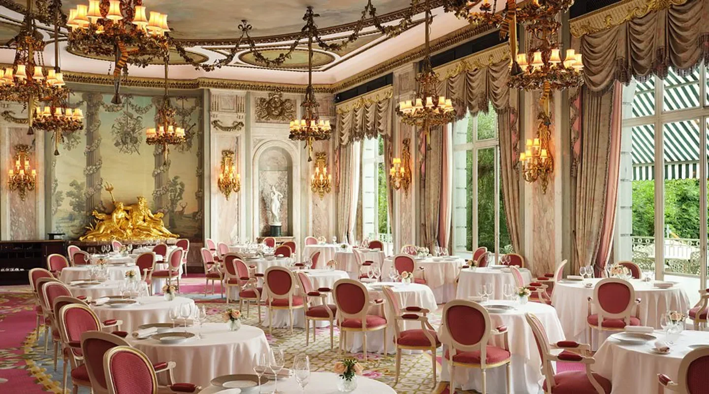 Elegant dining room at The Ritz Restaurant in London, with chandeliers and decorated tables.