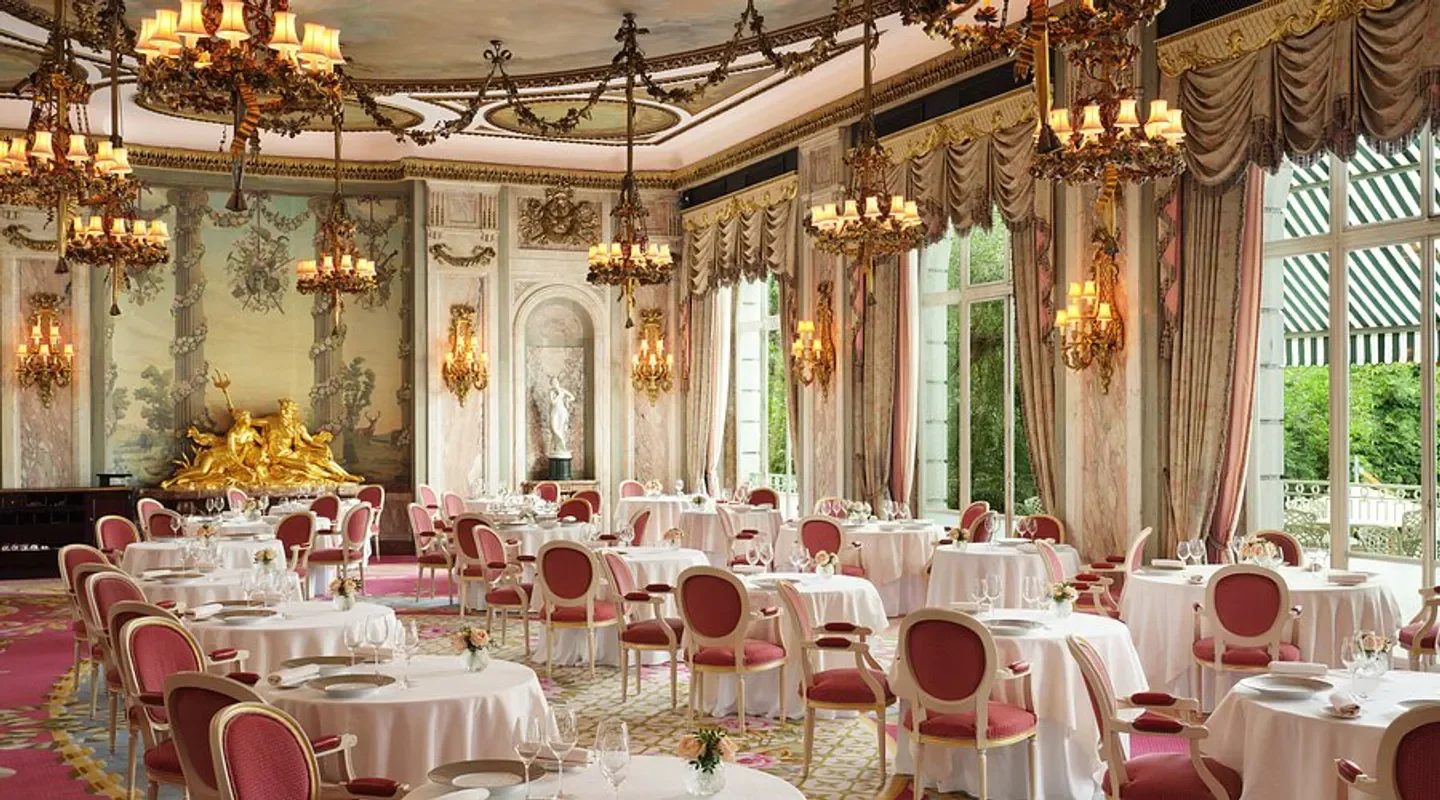 Elegant dining room at The Ritz Restaurant in London, with chandeliers and decorated tables.