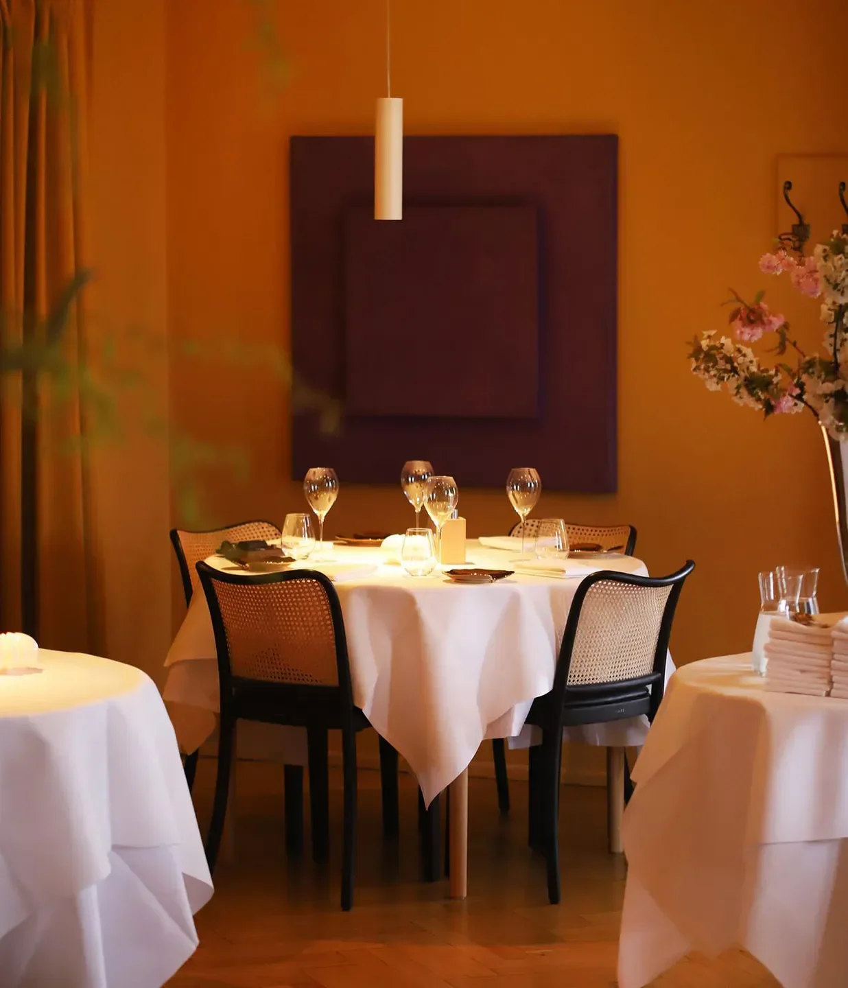 Cozy dining setting at The Samuel restaurant in Copenhagen, featuring elegant table decor.