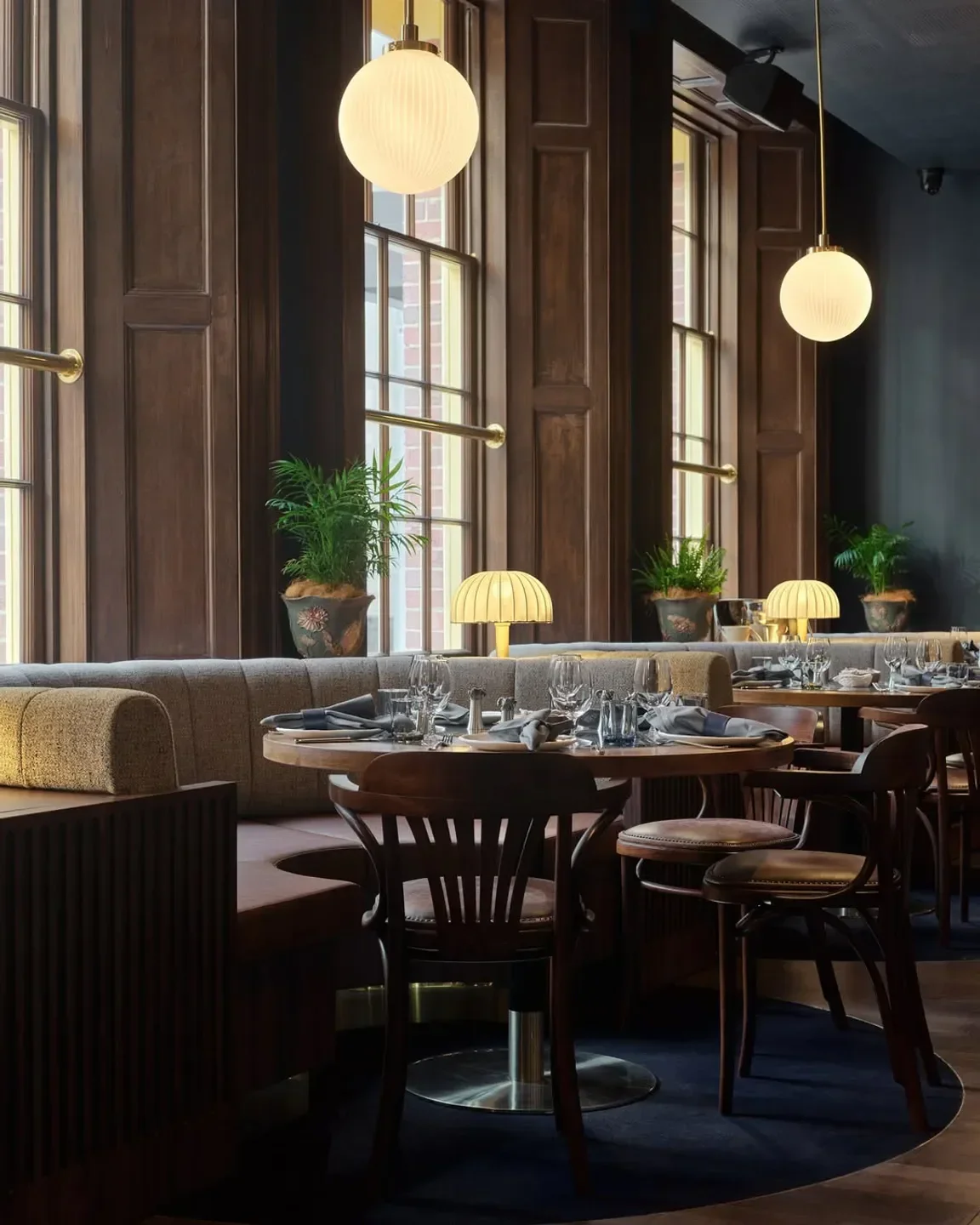 Cozy dining area at The Sanderson restaurant in Sydney, featuring elegant lighting and decor