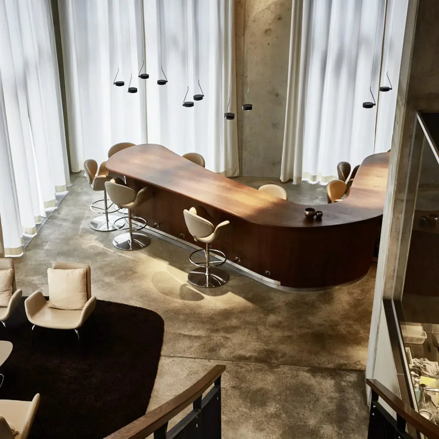 Elegant bar area at The Table Kevin Fehling restaurant in Hamburg, featuring stylish design.