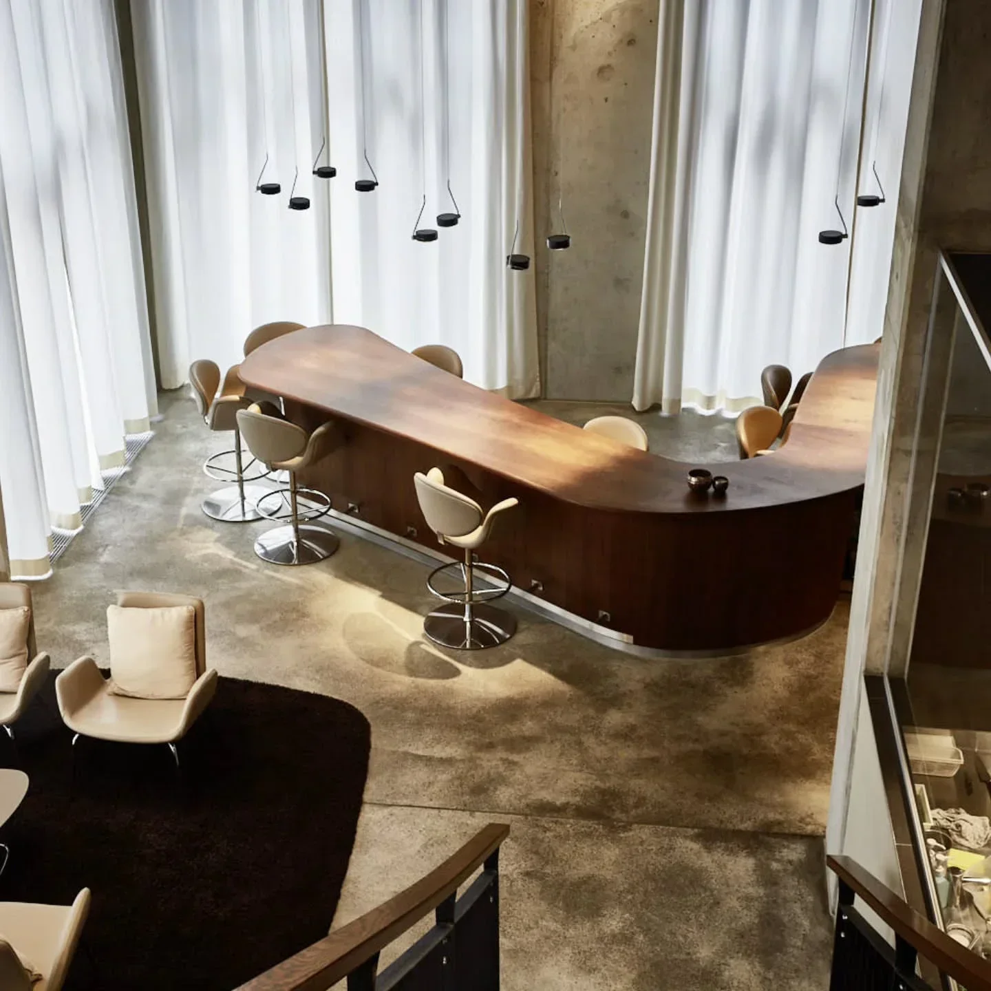 Elegant bar area at The Table Kevin Fehling restaurant in Hamburg, featuring stylish design.