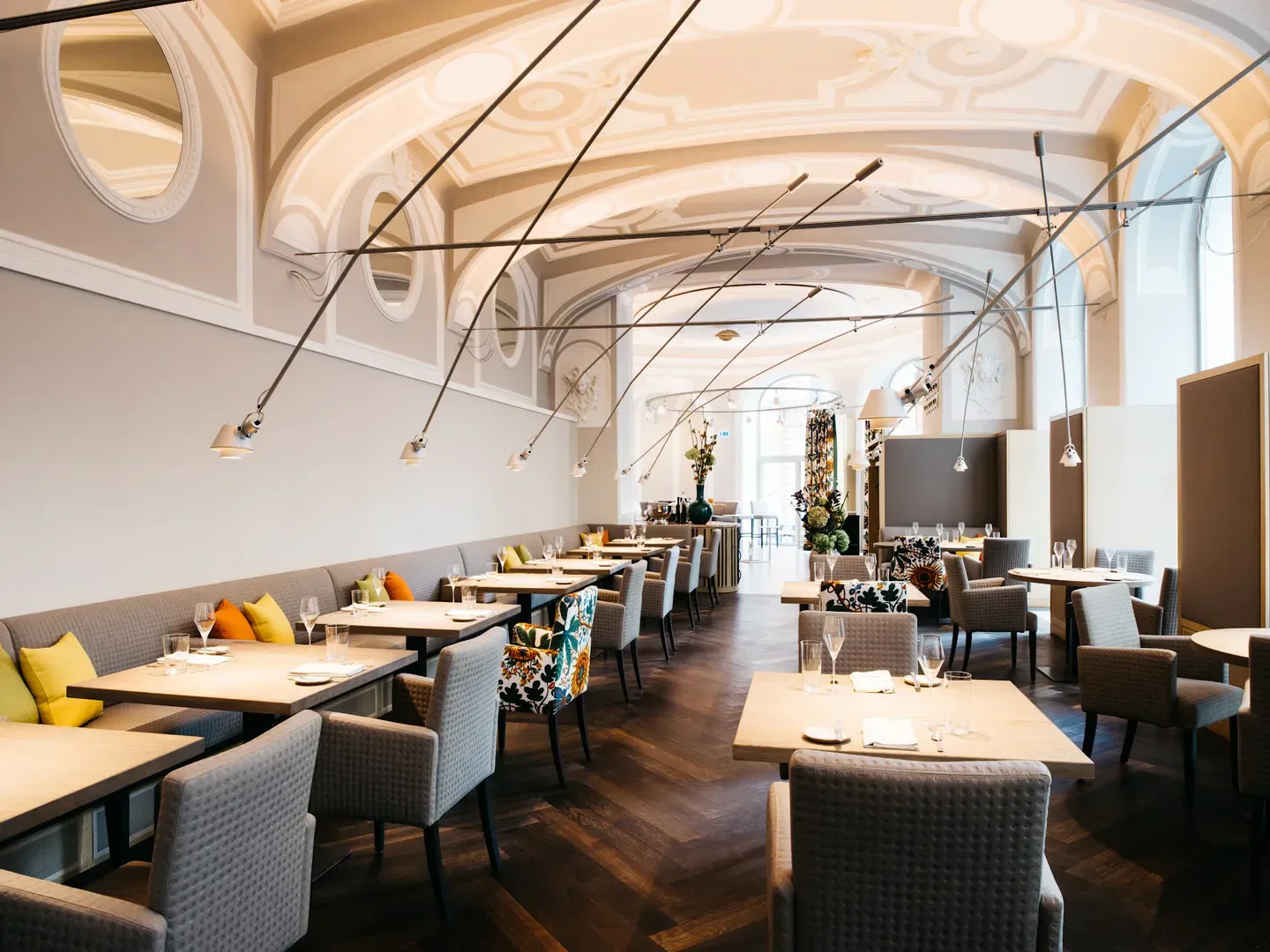 Elegant dining room interior at Tian restaurant in Vienna, featuring stylish decor and lighting.