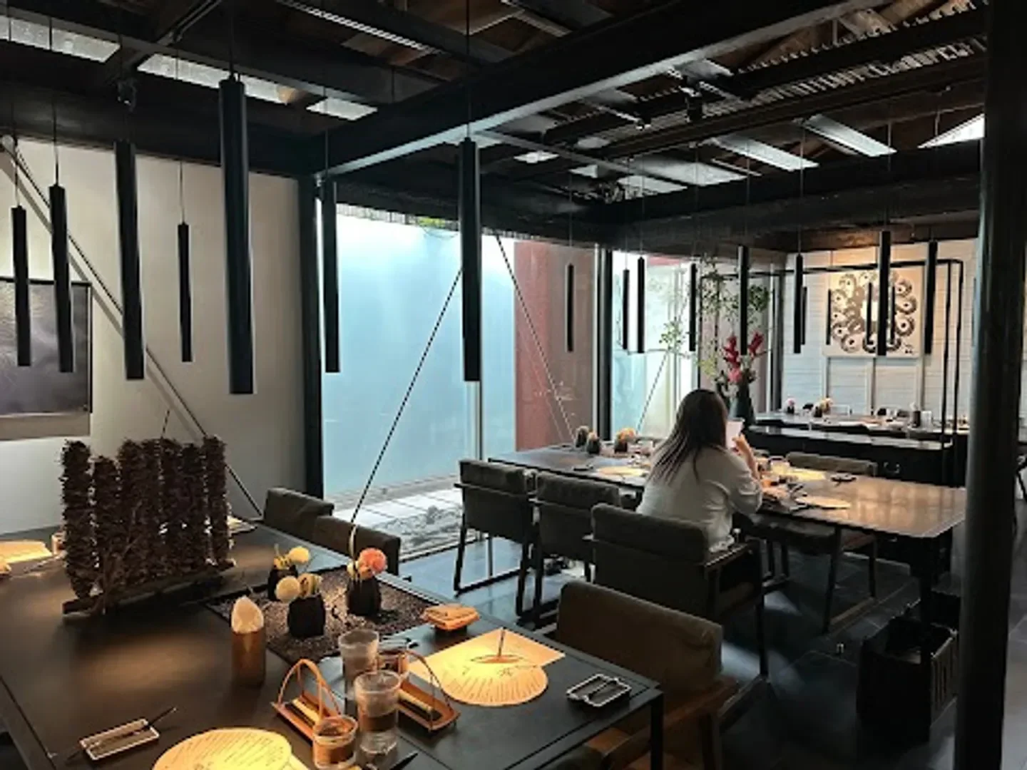 Interior of Toh-A restaurant in Taipei, featuring elegant dining tables and unique decor.
