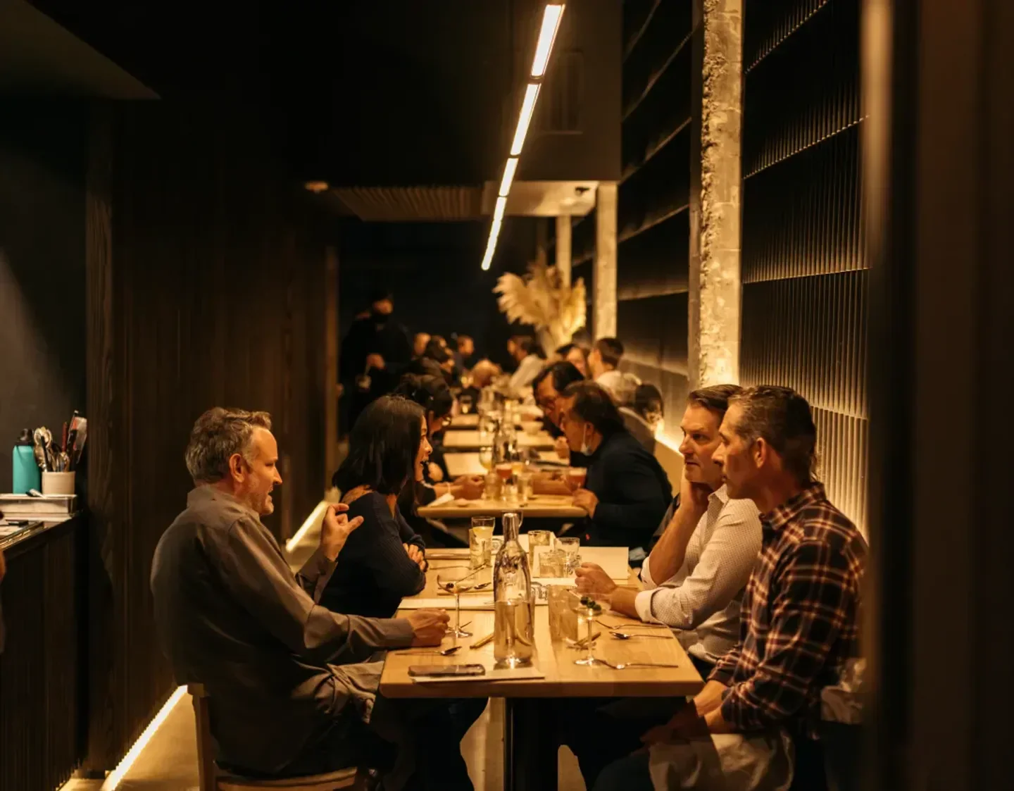 Dining scene at Tomo in Seattle, featuring diners enjoying a meal together.