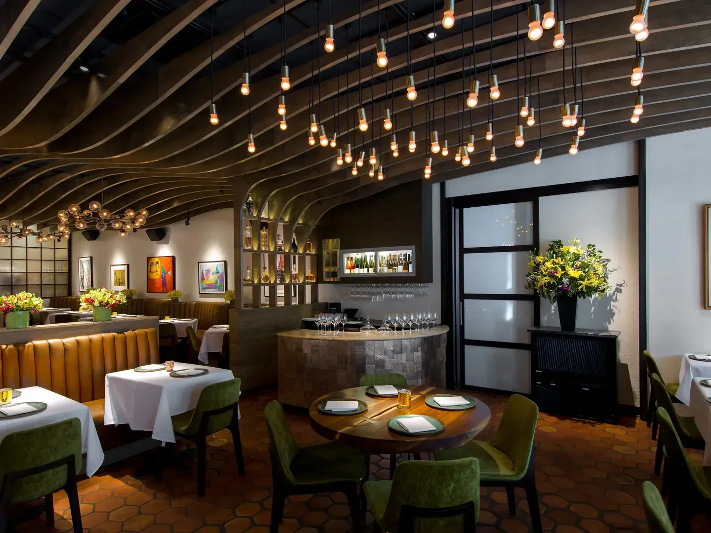 Elegant interior of Topolobampo restaurant in Chicago, with stylish lighting and decor.