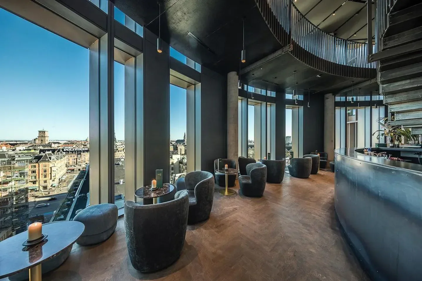 Elegant interior of Trio restaurant in Copenhagen, with city views and cozy seating