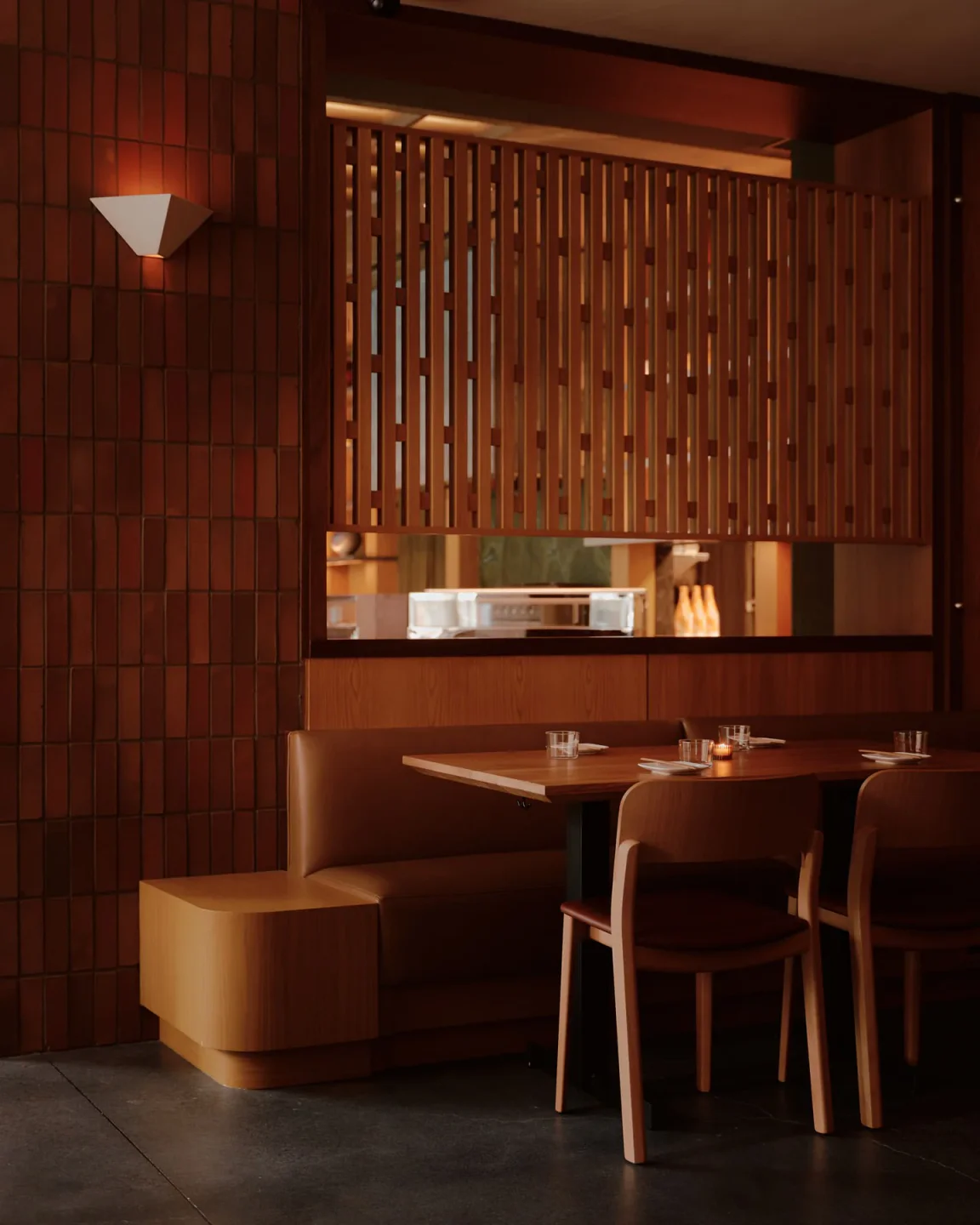 Modern wood and leather seating at Uchi West Hollywood restaurant in the city