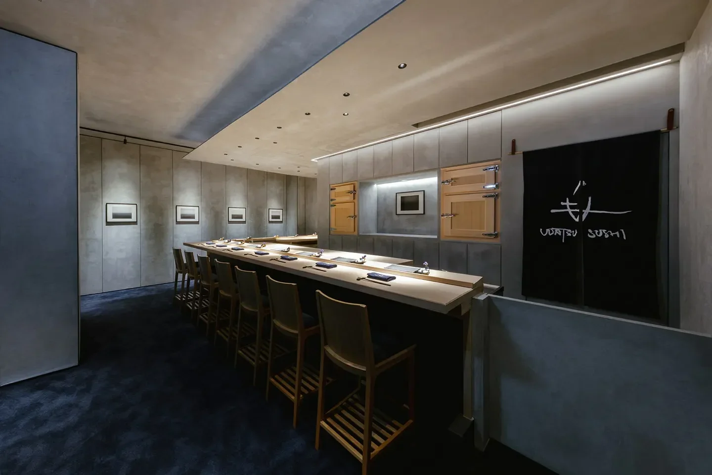 Interior of UDATSU SUSHI in Tokyo, showcasing elegant sushi bar and minimalist design.