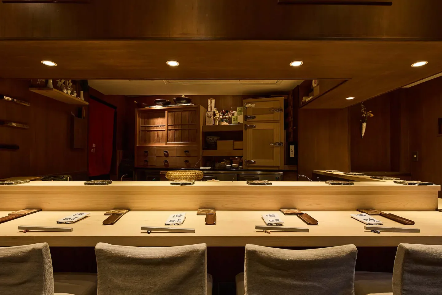 Cozy interior of Umi in Tokyo, showcasing the sushi bar and elegant dining space.