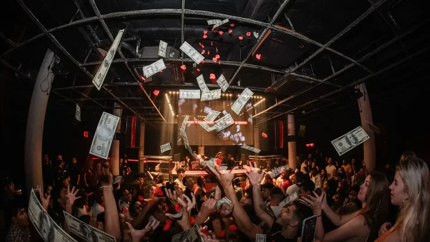 Nightclub Vault in Bali, people celebrating with money falling from the ceiling