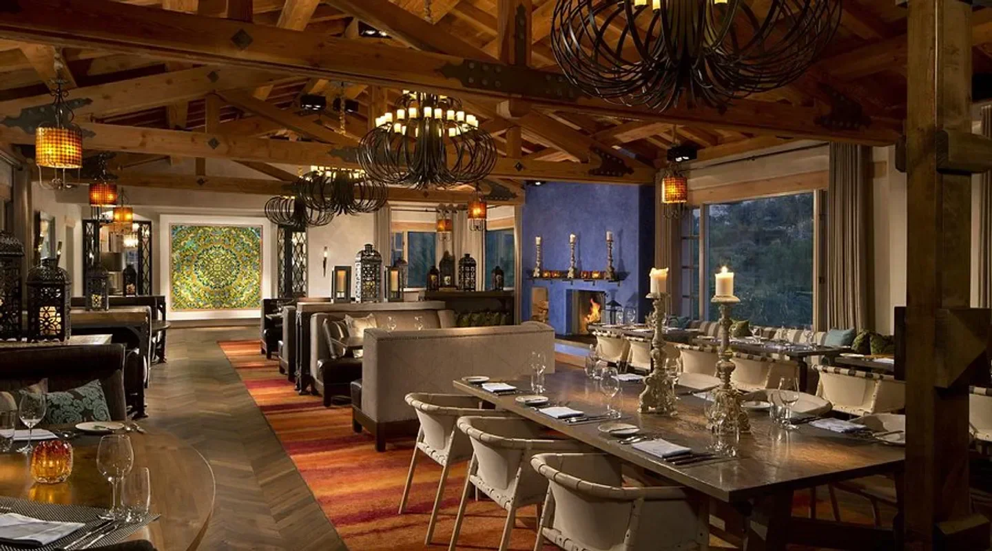 Interior of Veladora Coastal Ranch in San Diego featuring elegant dining and rustic design.