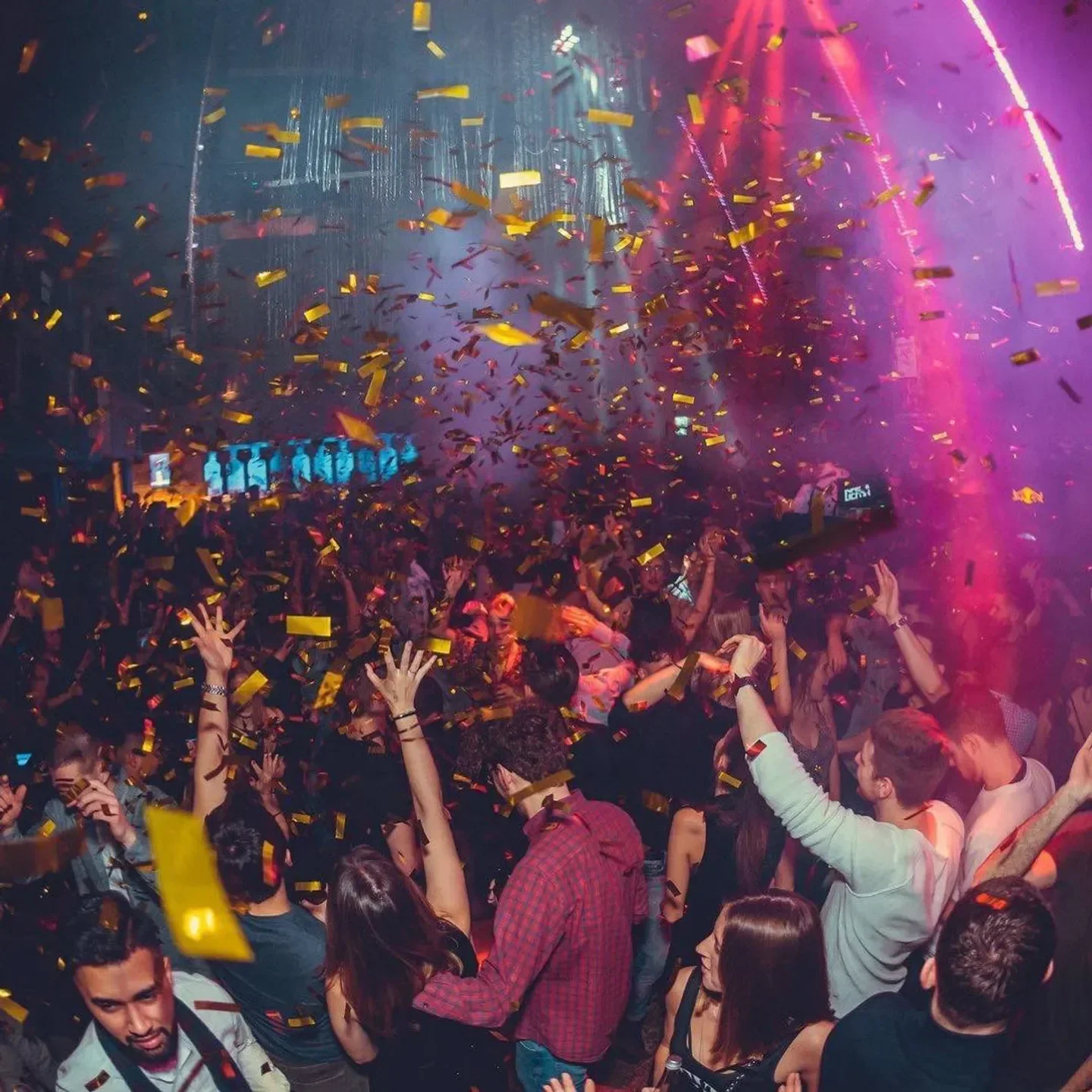 Energetic crowd celebrating at Velvet nightclub in Frankfurt with confetti falling.