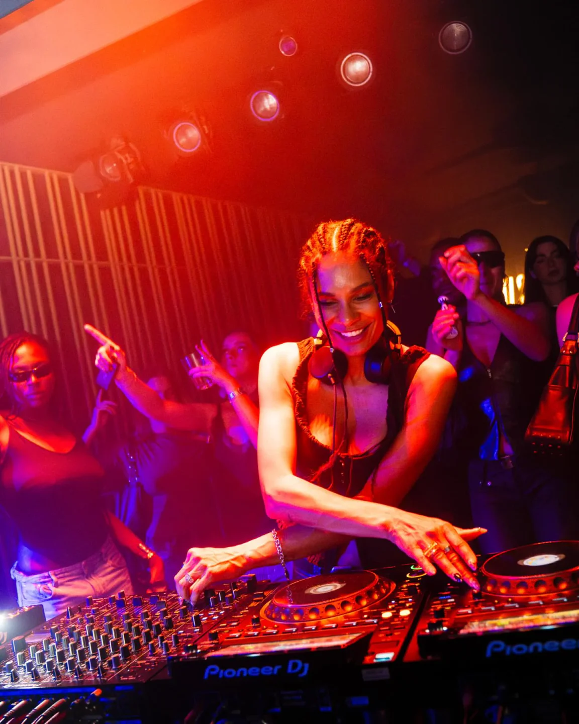 DJ performing at VOLT nightclub with crowd dancing and enjoying the music in the city.