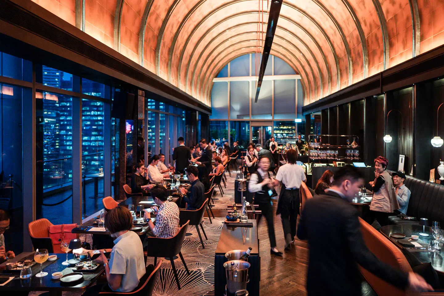 Dining at VUE Restaurant in Singapore, offering stunning city views and a vibrant atmosphere.