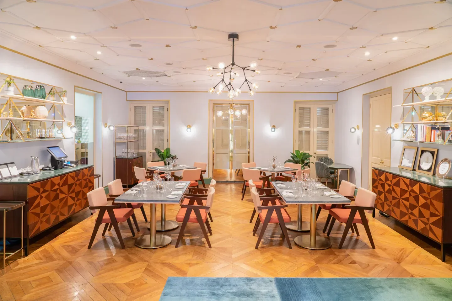 Elegant interior of Whitegrass restaurant in Singapore, featuring stylish decor and dining tables.