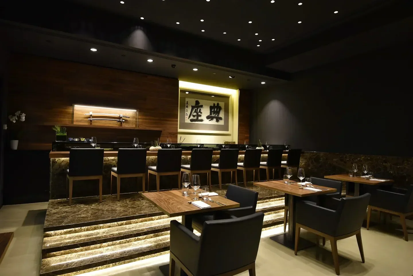 Elegant interior of Wicky's Innovative Japanese Cuisine in Milan, featuring sushi bar and seating.